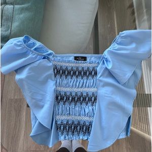 Super cute milk and honey cropped blouse with ruffles. Carolina blue